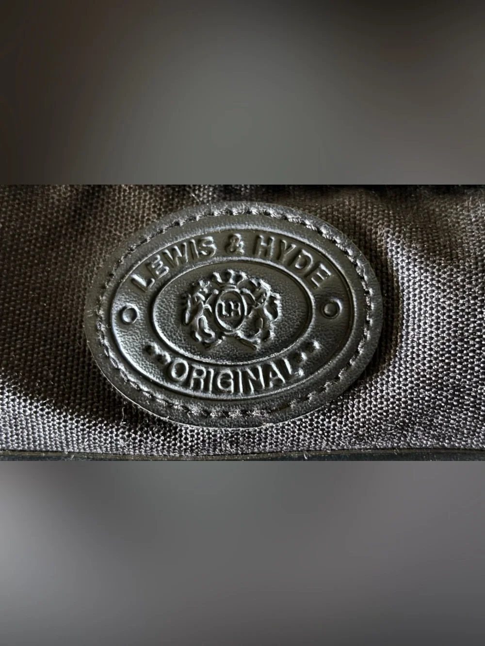 The Original Lewis & Hyde Dark Gray Carry on Bag w/ shoulder strap.